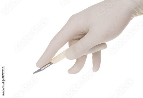 scalpel holded by doctor's hand on white background
