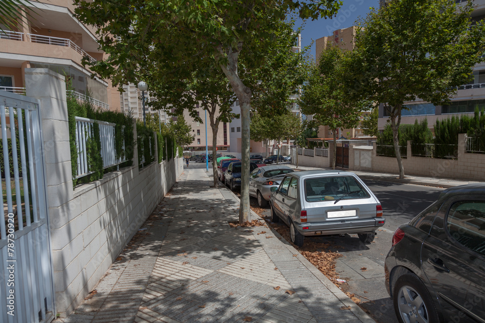 Quiet street with parked cars. Calpe, Spain. Quiet street with parked cars. Calpe, Spain.