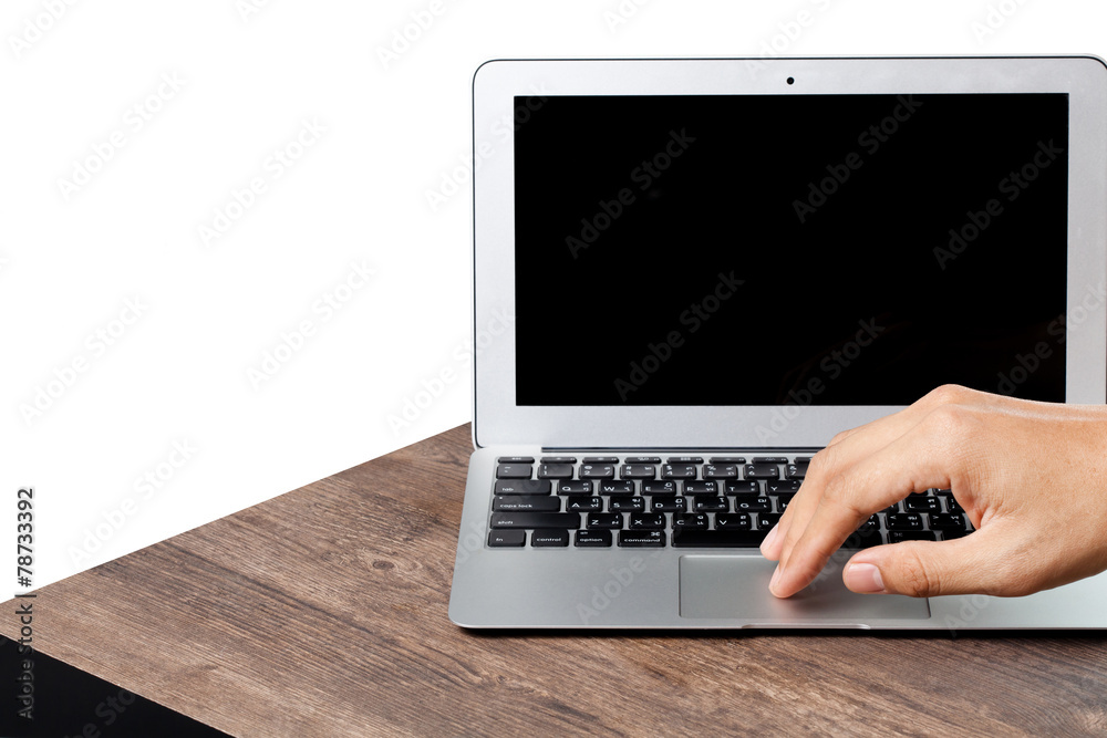 hand using a laptop on wood table, white background