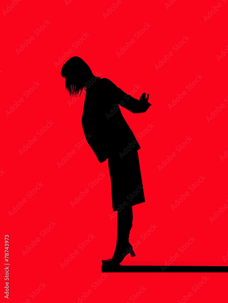 Silhouette of a woman close to fall down