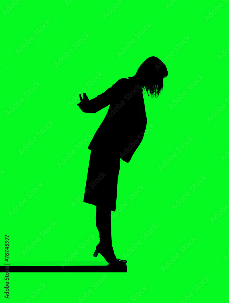 Silhouette of a woman close to fall down Silhouette of a woman close to fall down