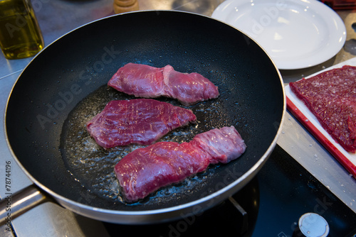 Stewed steaks on hot fraying pan