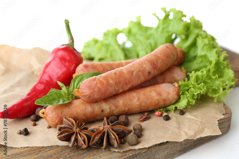 Smoked thin sausages with lettuce salad leaves and spices Smoked thin sausages with lettuce salad leaves and spices