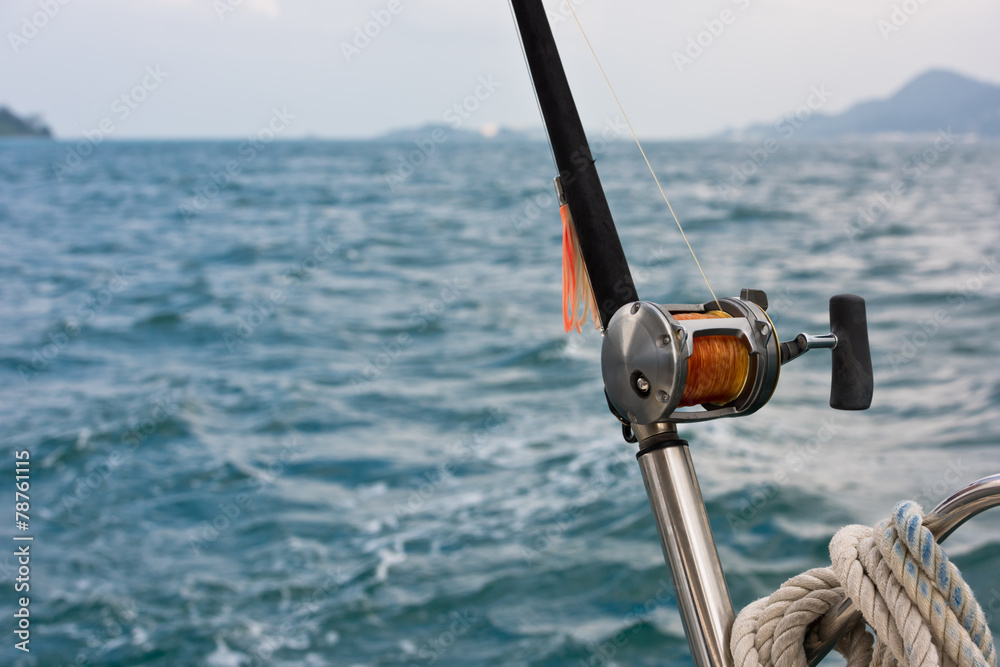 Fishing rod and reel on a boat Stock Photo