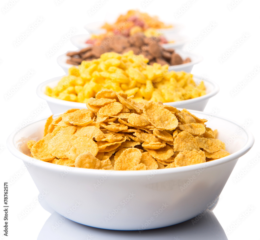 Mix variety of breakfast cereal in white bowls Mix variety of breakfast cereal in white bowls