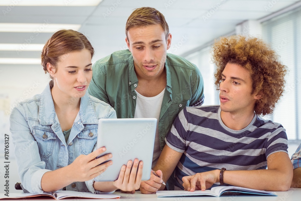 Obraz premium Fashion students using tablet