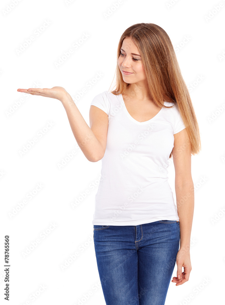 Happy young woman in tshirt showing empty copyspace Happy young woman in tshirt showing empty copyspace