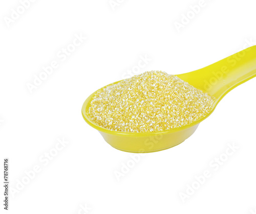 Corn grits in a spoon photo