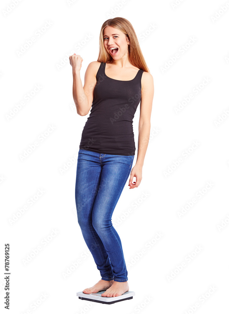 Girl standing on scale weight is happy Girl standing on scale weight is happy