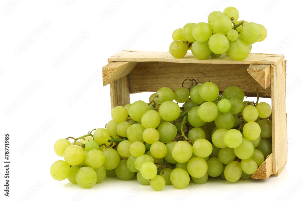 fresh white seedless grapes on the vine in a wooden crate fresh white seedless grapes on the vine in a wooden crate