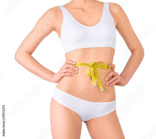 Slim woman in white underwear and measure around her body on