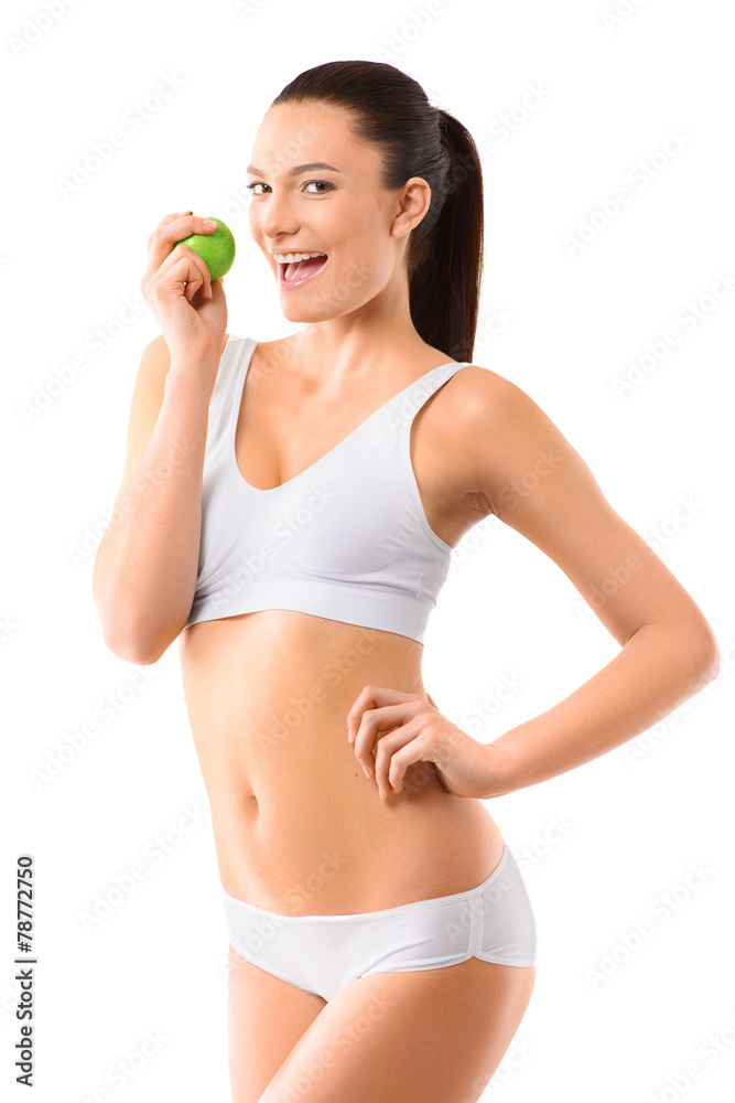 Slim woman in white underwear with green apple at her hands over Slim woman in white underwear with green apple at her hands over