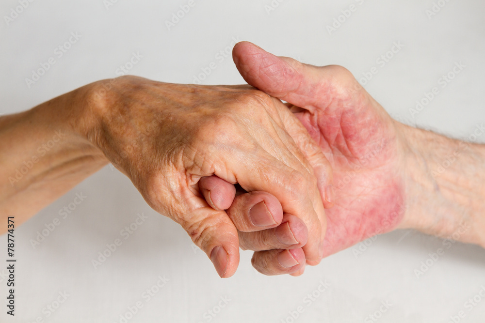 Fototapeta premium Old people holding hands. Closeup.