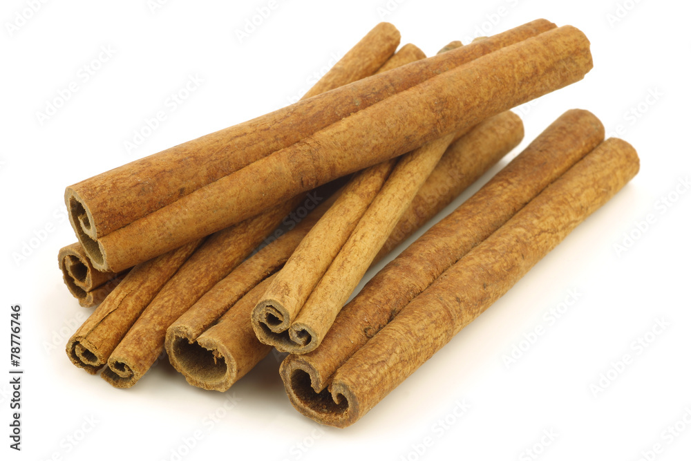 dried cinnamon sticks on a white background dried cinnamon sticks on a white background