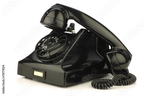 Photos vintage bakelite telephone on a white background