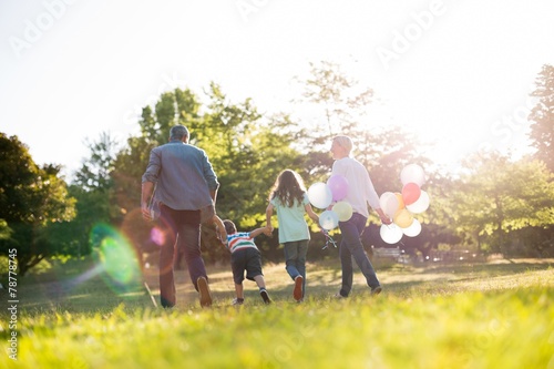 Happy family walking at the park