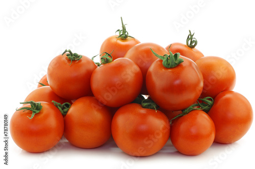 tomatoes on the vine on a white background