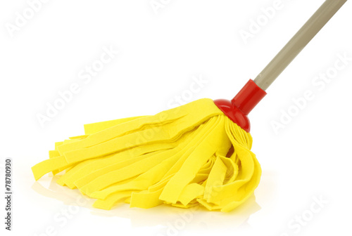 yellow cleaning mop isolated on white background photo
