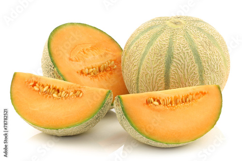 fresh cantaloupe melon and a cut one on a white background
