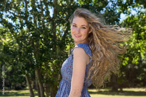 Tableau sur toile Pretty blonde smiling in the park