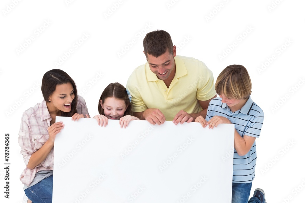 Family of four looking at billboard Family of four looking at billboard
