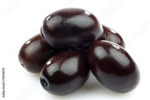 bunch of black olives on a white background