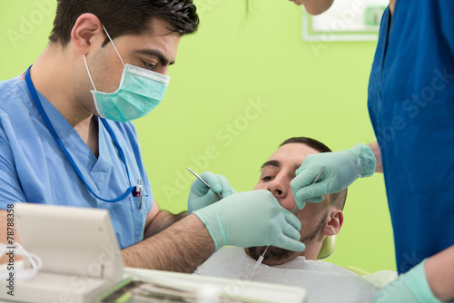 Young Male Having His Teeth Dental Care