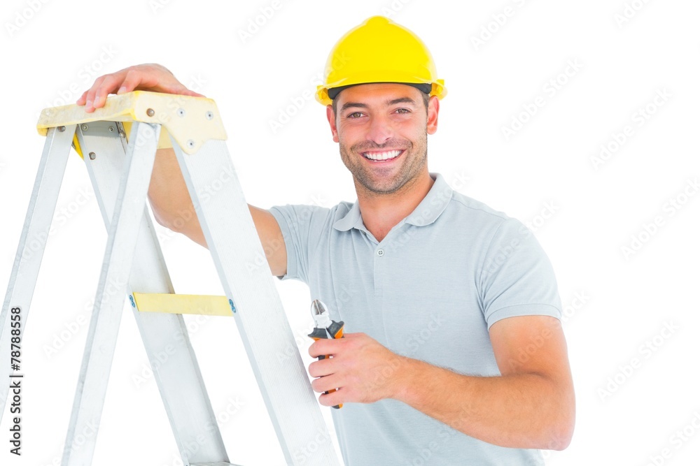 Portrait of happy repairman with pliers climbing ladder Portrait of happy repairman with pliers climbing ladder