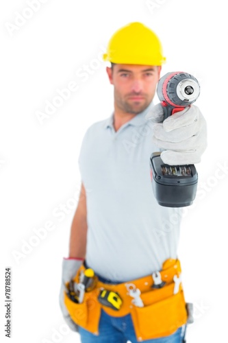 Portrait of handyman using power drill