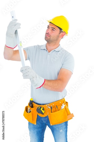 Handyman examining spirit level