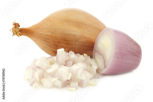 fresh shallot and a cut one on a white background