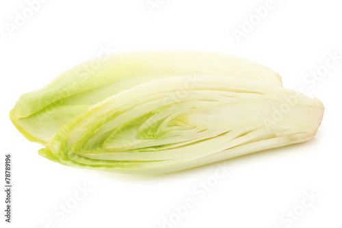 fresh chicory and a cut one on a white background