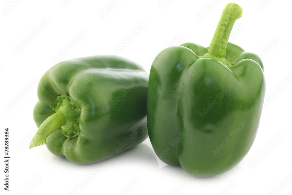 fresh green bell peppers (capsicum) on a white background fresh green bell peppers (capsicum) on a white background
