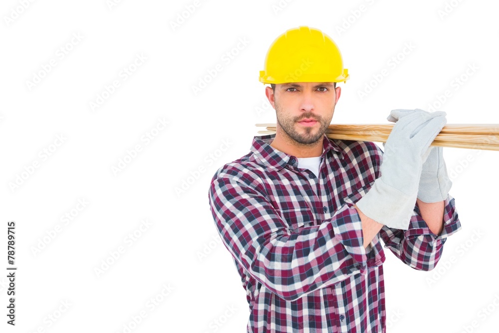 Handyman holding wood planks Handyman holding wood planks