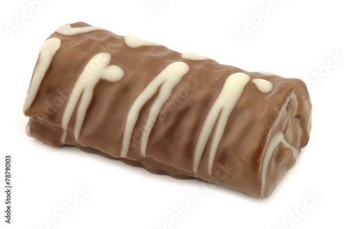 delicious chocolate and cake roll on a white background