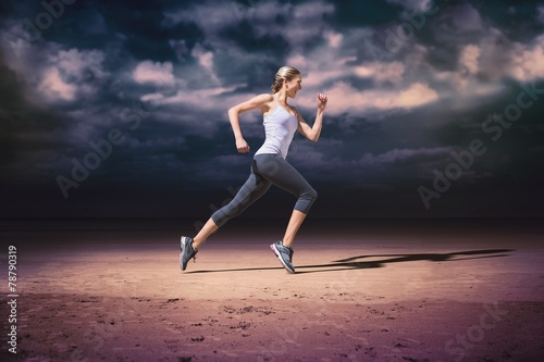 Composite image of pretty fit blonde jogging