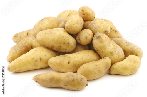 original french "ratte"potatoes (Solanum tuberosum) on a white b