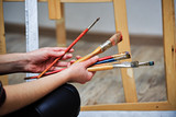 Painter holds the brush