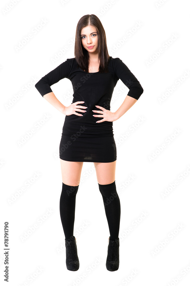 Fototapeta premium young beautiful dancer posing on a studio background