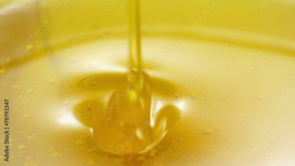 Honey dripping from honey dipper in 3840X2160 4K UHD video. Honey dripping from honey dipper in 3840X2160 4K UHD video.