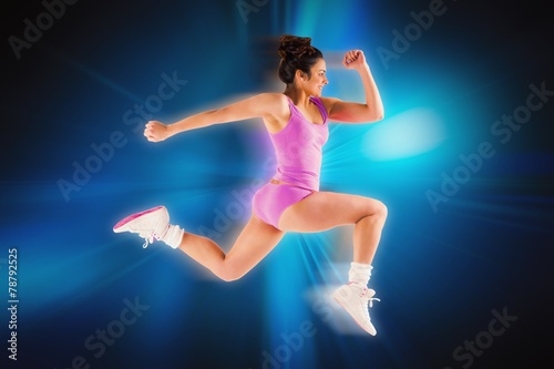 Composite image of fit brunette running and jumping © WavebreakMediaMicro