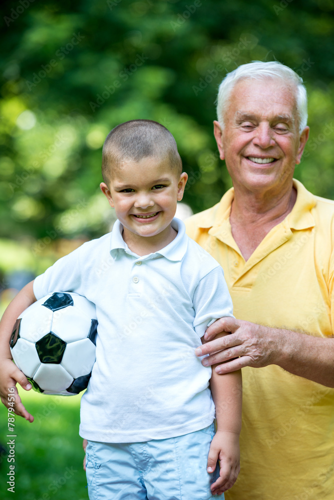 grandfather and child have fun in park grandfather and child have fun in park
