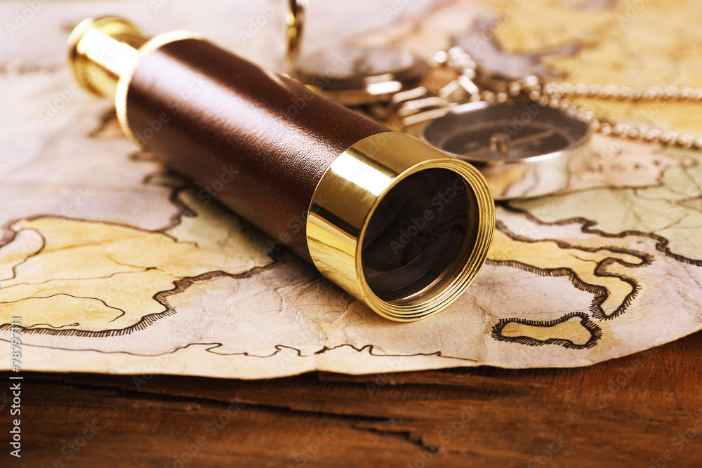 Marine still life with world map and spyglass
