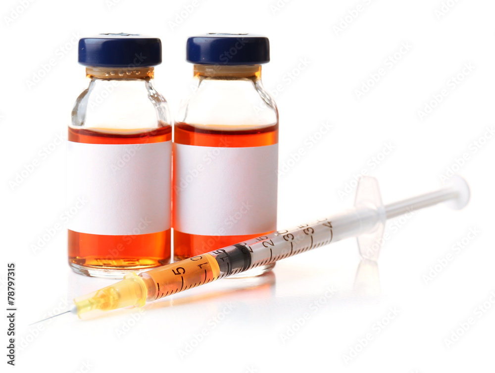 Medical ampules with syringe isolated on white Medical ampules with syringe isolated on white