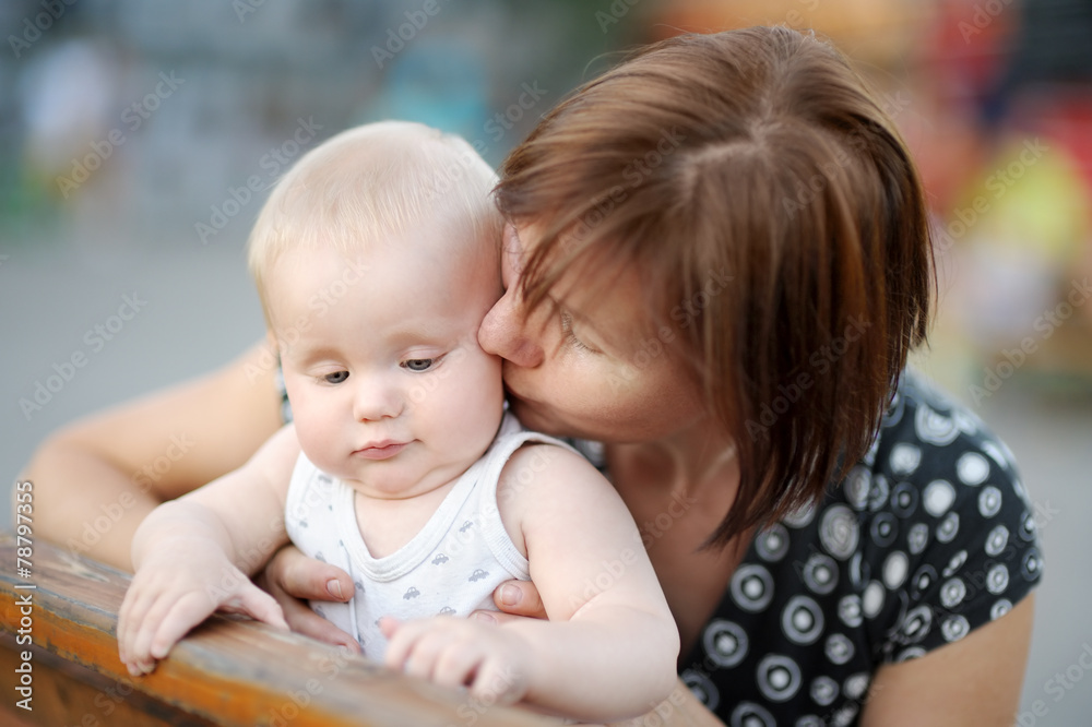 Beautiful middle aged woman and her adorable little grandson Beautiful middle aged woman and her adorable little grandson