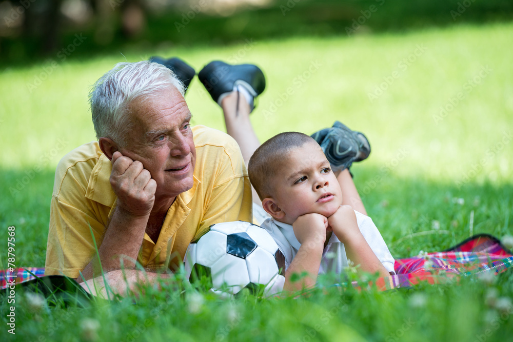 grandfather and child have fun in park grandfather and child have fun in park