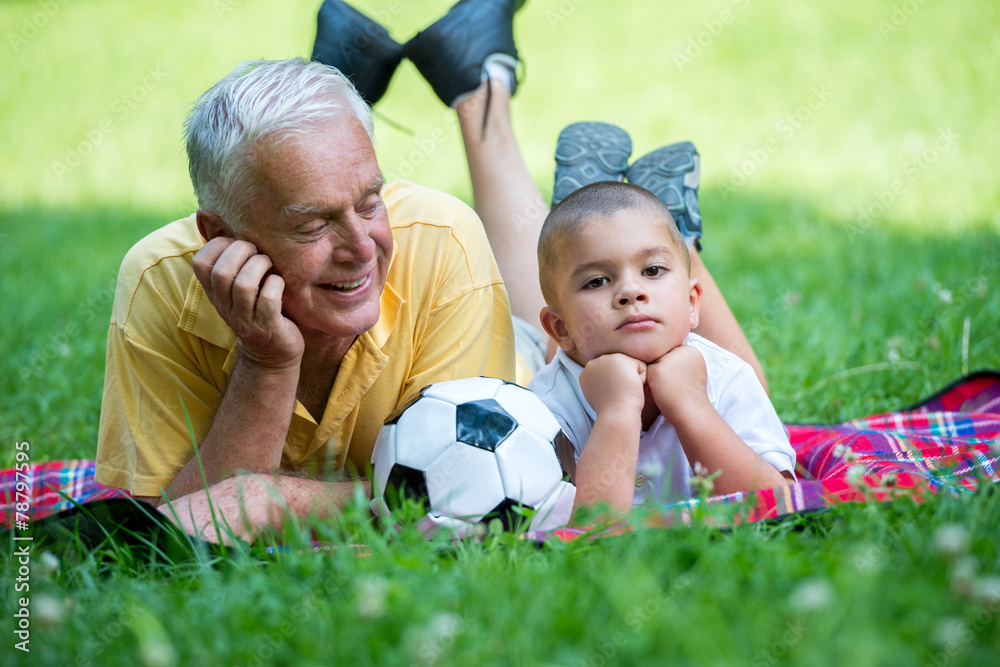 grandfather and child have fun in park grandfather and child have fun in park