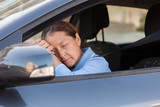 woman sleeping in   car.
