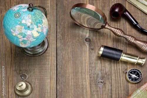 OldTravel And Adventure Objects On The Wooden Grunge Table