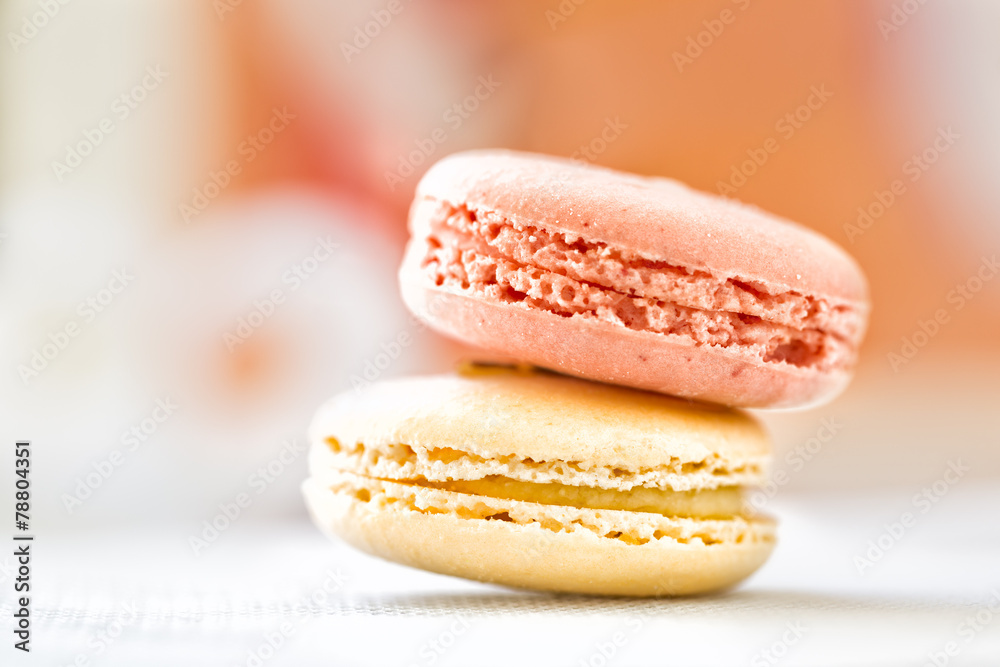 Close up of two macaroon cookies in pastel colors. Selective foc Close up of two macaroon cookies in pastel colors. Selective foc